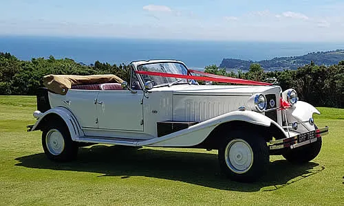 The Beauford on a coastal lane with the soft top down.